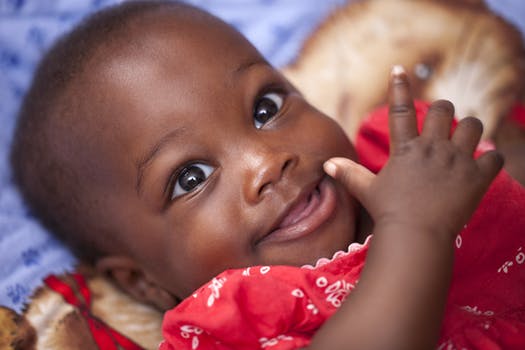 Close up portrait of smiling baby as part of baby photography Glasgow portfolio