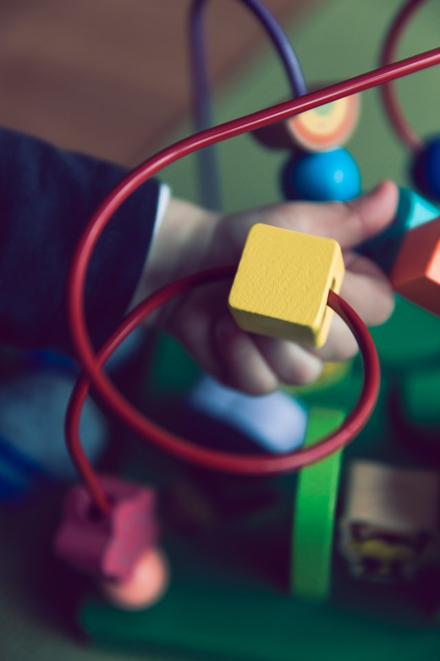 child playing with toy